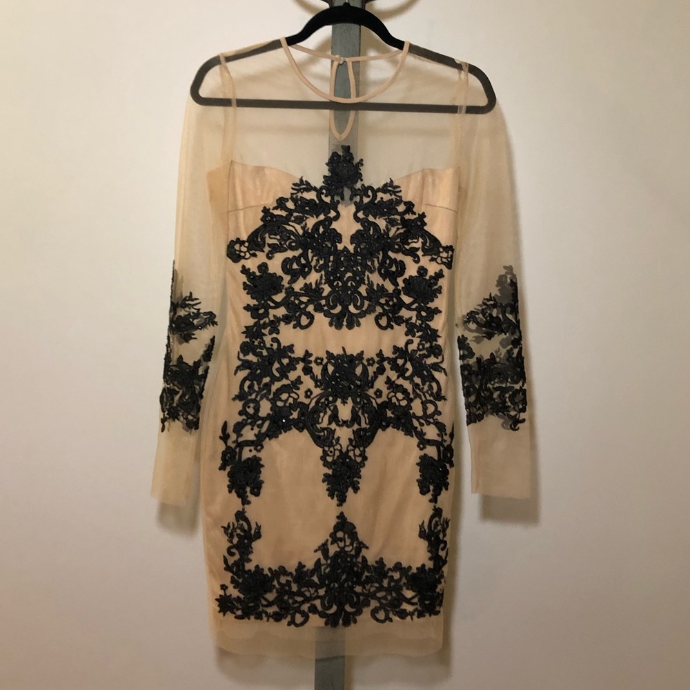 Black and nude embroidered dress.